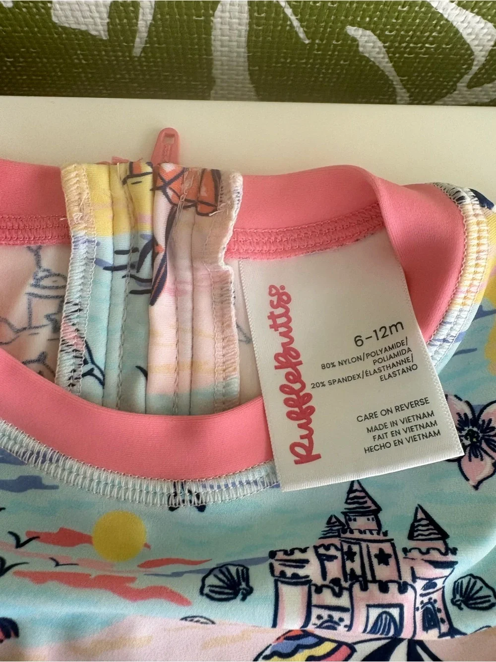 RuffleButts Pink-Trim Pastel Beach Print Rashguard Onesie⛱️